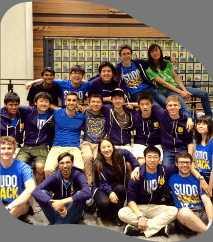 Cal Hacks 2014 hackers in Sudo Hack shirts posing on a staircase